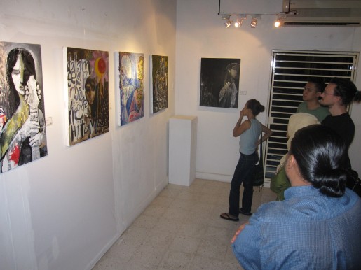 Visitors pondering at Fathullah Luqman's work 