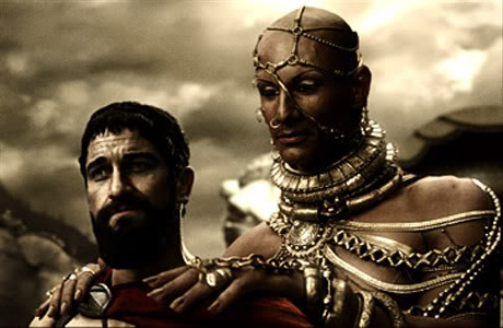 Screenshot from the film 300 of the androgynous Persian God-king, Xerxes, giving King Leonidas a massage. Ok, no. They were discussing the possibility of a Spartan surrender